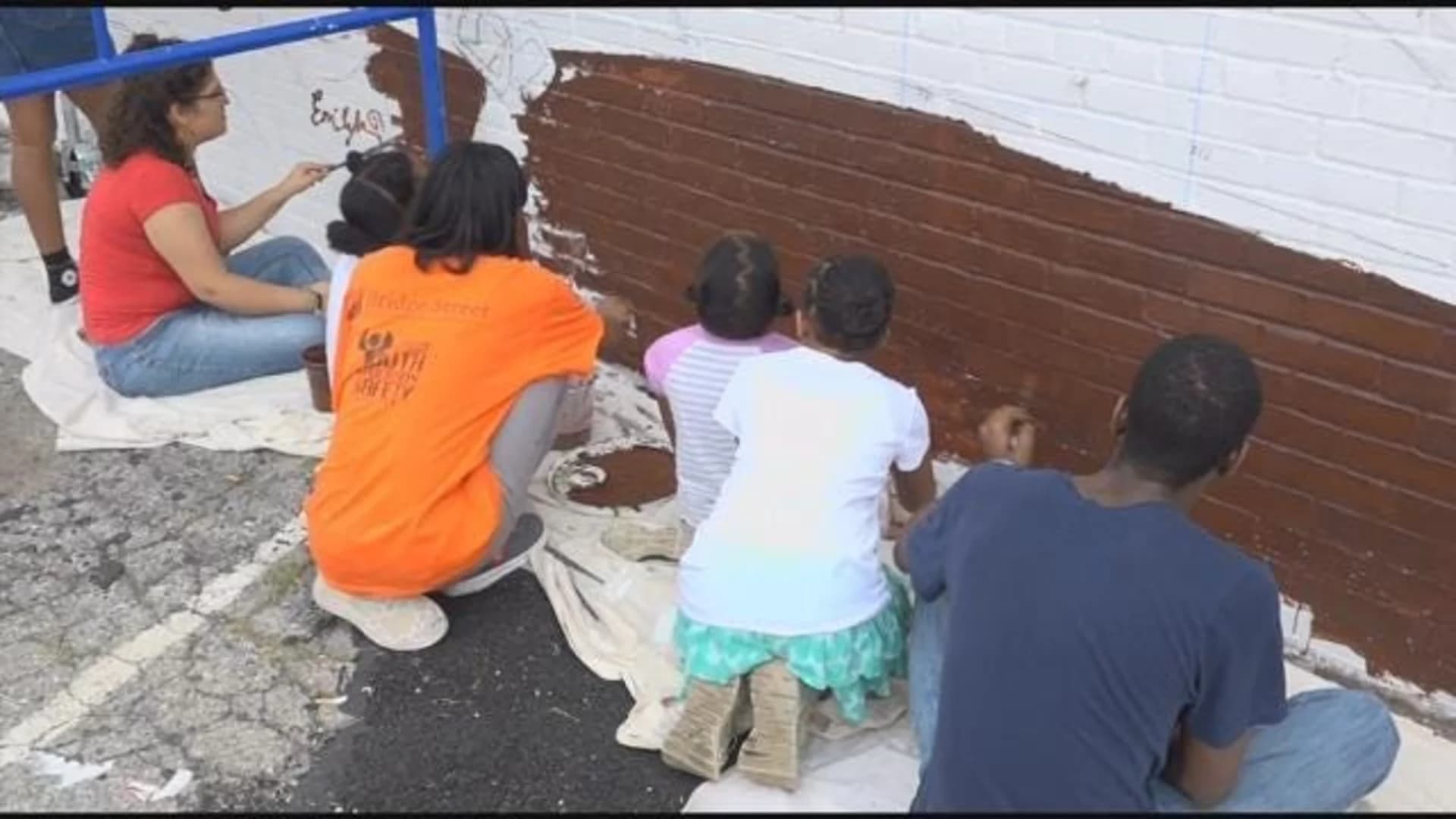 Students take on immigration with Bed-Stuy mural