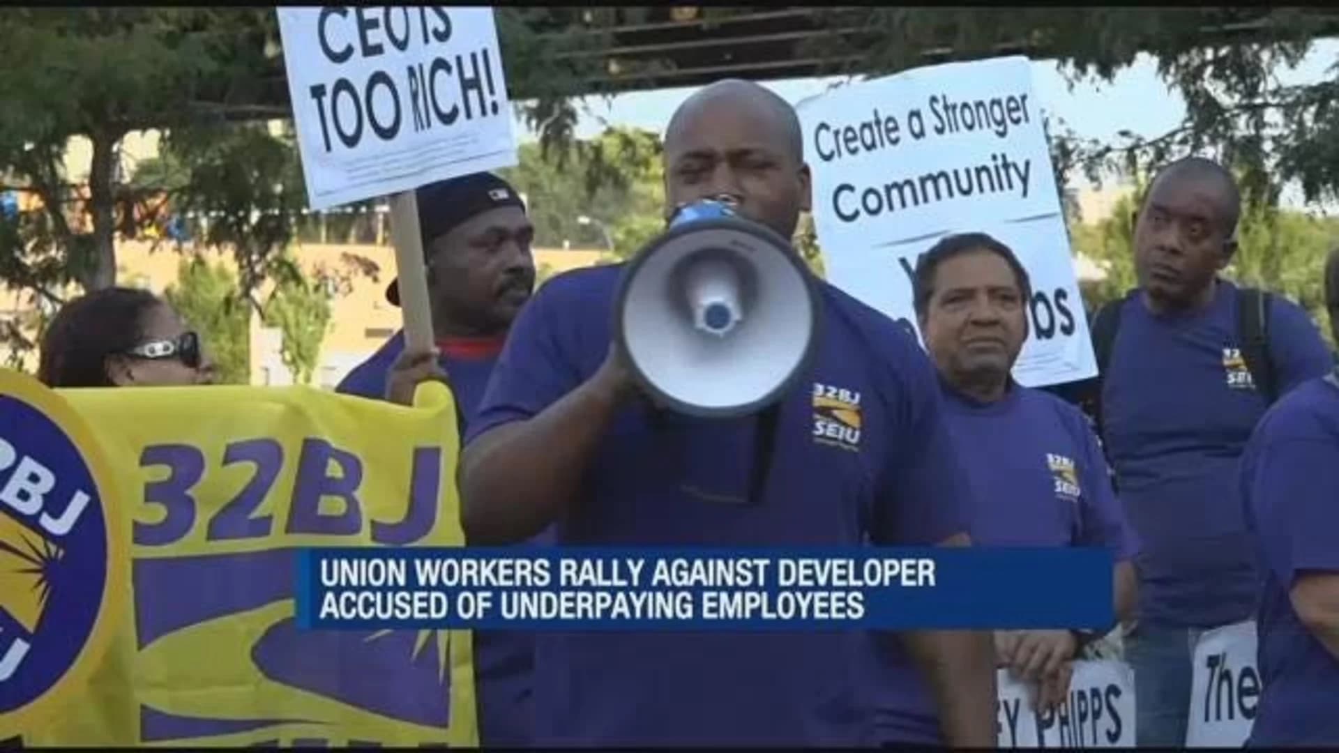 Service workers union rallies against developer