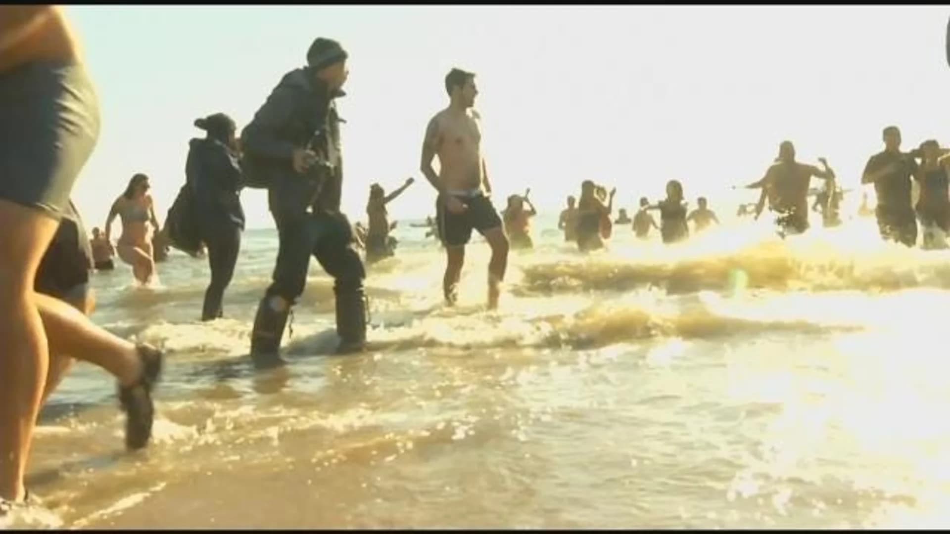 Crowds take dip in ocean for Polar Bear Plunge in Coney Island