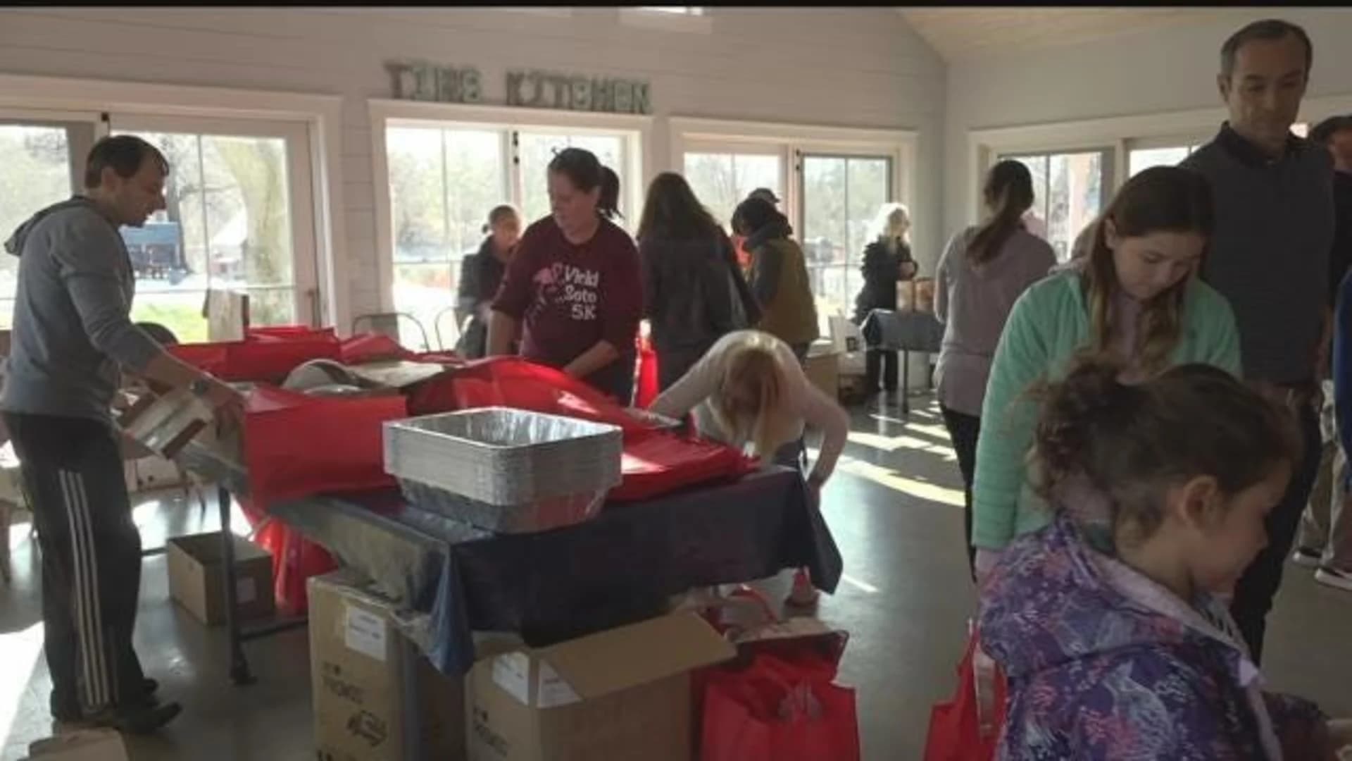Volunteers pack Thanksgiving meals for needy families in Westport