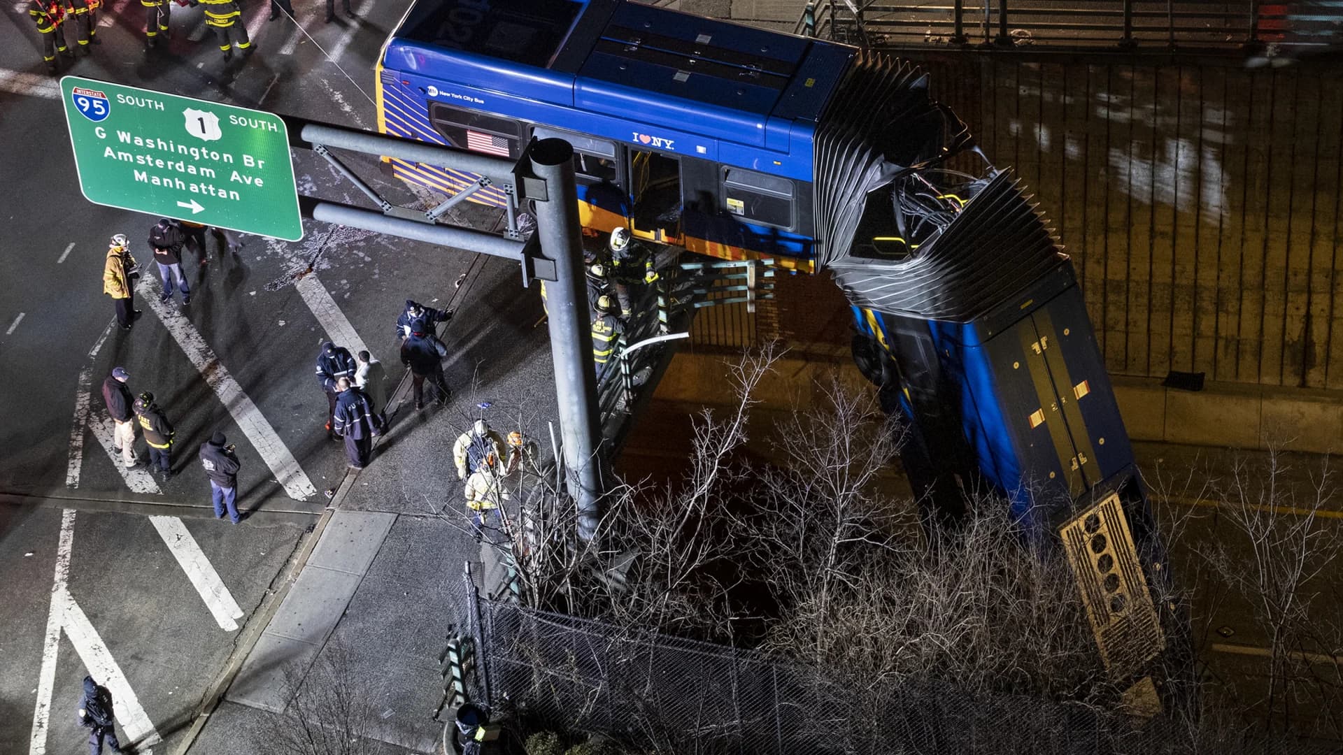 Police: Driver seriously injured, 8 passengers hurt when MTA bus was left dangling from overpass after crash in Morris Heights
